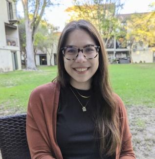 Women with brown hair and glasses